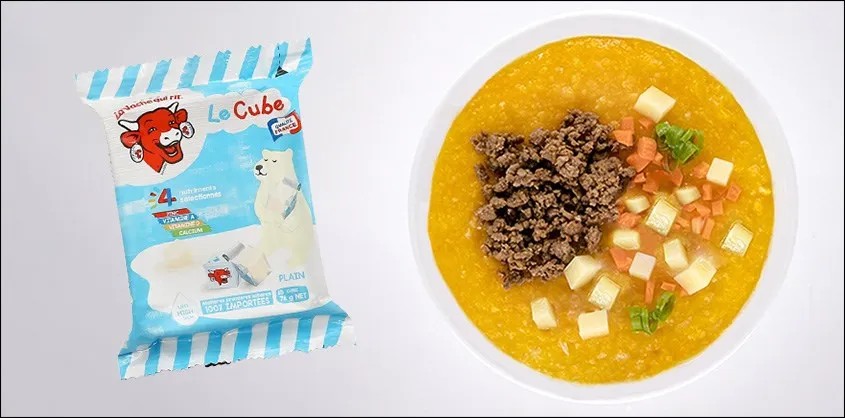Bát cháo vàng ươm với trứng gà và phô mai, minh họa một cách nấu cháo phô mai con bò cười cho bé bổ dưỡng.