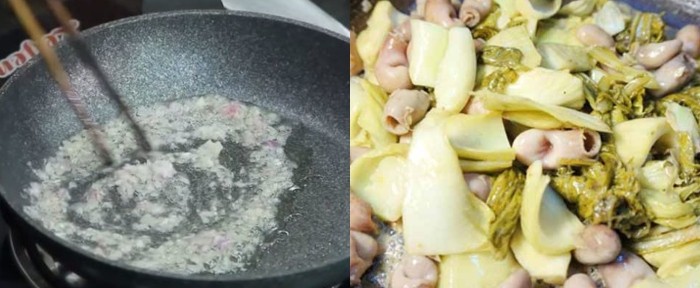 Món lòng cá trắm xào dưa chua đang được xào trên chảo nóng, tỏa hương thơm lừng